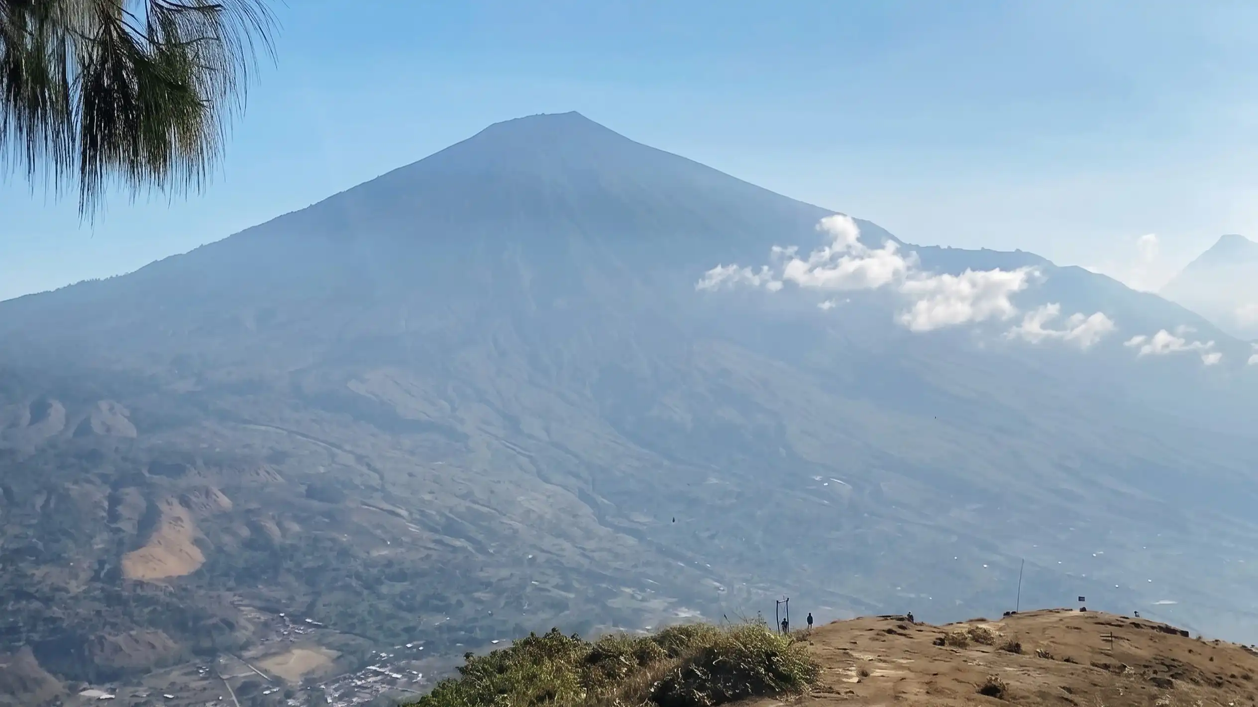 Mount Rinjani seen from the ridge of Pergasingan Hill in Lombok