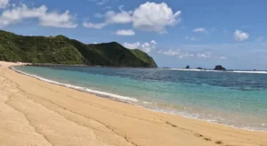 Sandy bay, turquoise water and rocky islets at Tampah Beach in Lombok